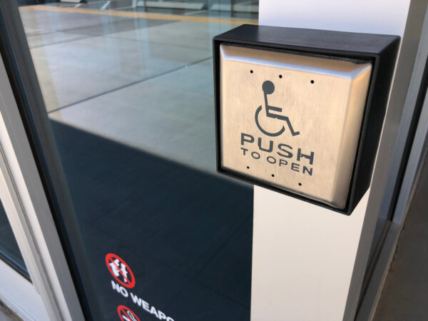 Automatic door push plate