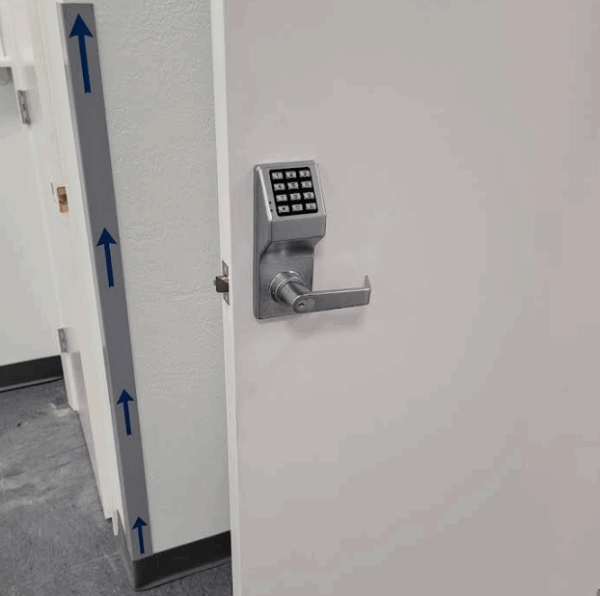 A keypad lock on a door.