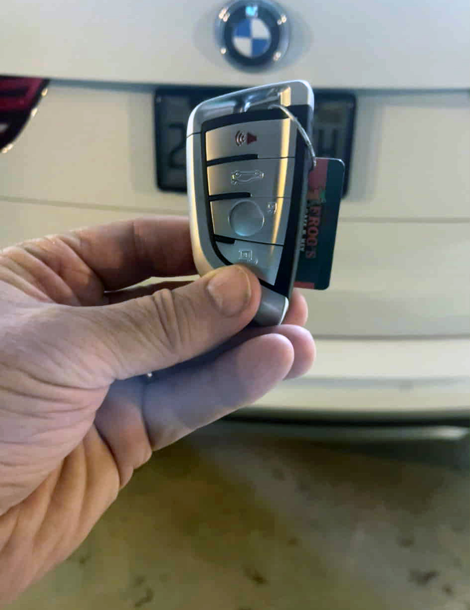 A replacement key fob for a BMW car.