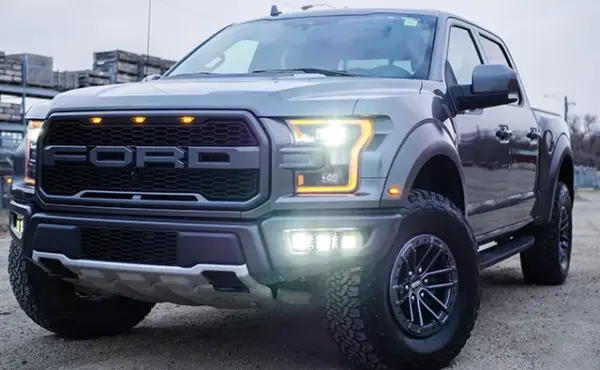 A large Ford truck, viewed from the front grill.